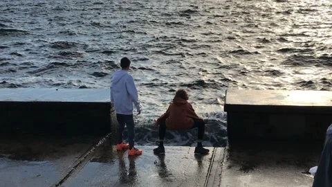Children playing with the waves Stock Footage 145912232
