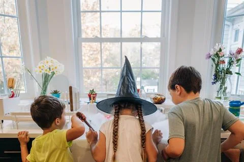 Children playing witch magic experiment in kitchen sink smoke Stock Photos