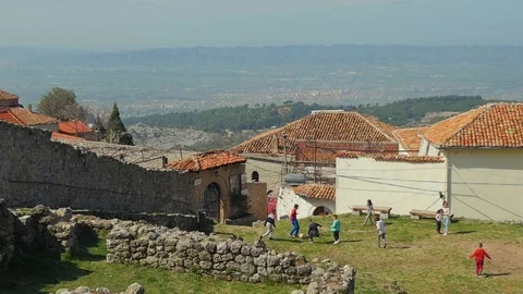 Children playing within the old castle in Kruja, Albania Stock Footage 106708526