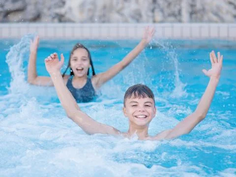 Children in pool Stock Photos