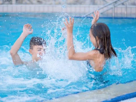 Children in pool Stock Photos