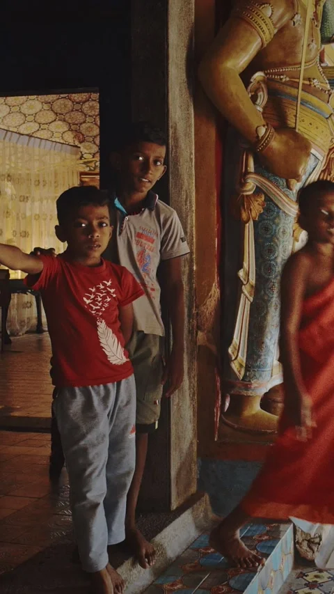 Children posing in ancient temple room. Unawatuna, Sri Lanka. Yatagala RajaMaha Stock Footage 336343622