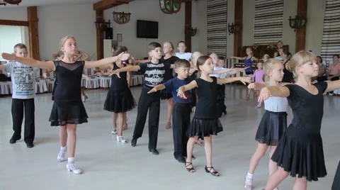 Children practice ballroom dancing in the hall Stock Footage 62193501