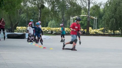 Children Practicing Inline Slalom During Group Lesson Stock Footage 340231078