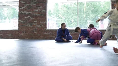 Children practicing Jiu-jitsu moves Stock Footage 77080496