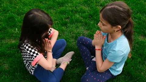 Children praying in the park. Selective focus. Stock Footage 304585944