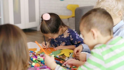 Children preparing decorations for Easter  Stock-Footage 103658760