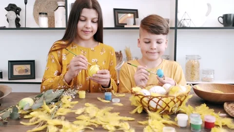 Children preparing for Easter in the kitchen Stock Footage 160792348