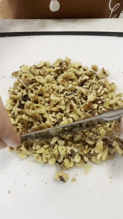 Children Preparing Walnuts on a Cutting Board Stock Footage 334946634