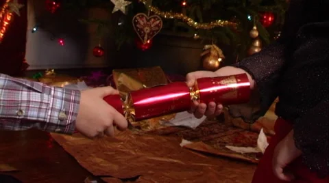 Children pulling Christmas cracker. Stock Footage 43697797