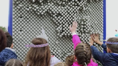 Children push elements of toy on street during City Day holiday Video stock 276377321