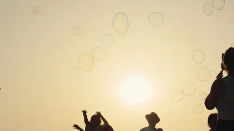 Children reaching for soap bubbles Stock Footage 340627414