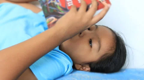 Children reading on the bed Stock Footage 42163730