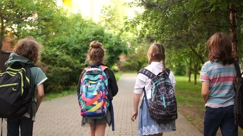 Children return from school, throw up papers, last day of study, start of Stock Footage 109455577