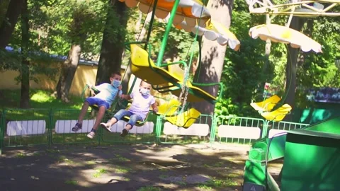 Children ride the attraction Stock Footage 138884257