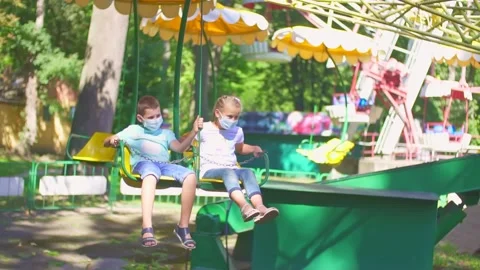 Children ride the attraction Stock Footage 138980483