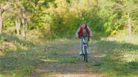Children ride bicycles Stock Footage 164163012