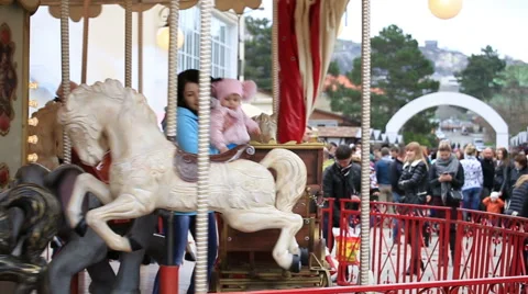 Children ride on the carousel Stock Footage 67363190