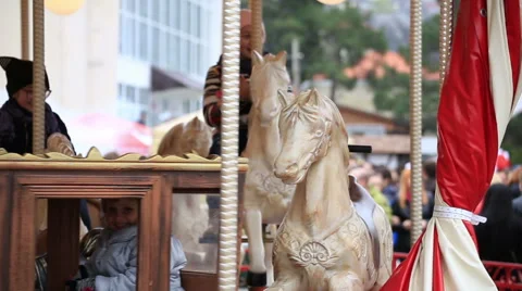 Children ride on the carousel Stock Footage 67363238