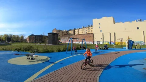 Children ride on the Playground Stock Footage 130108035