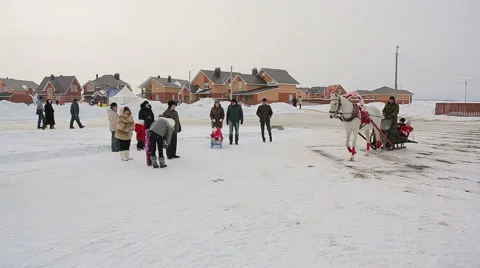 Children ride in a sleigh, arrival Stock Footage 44398491