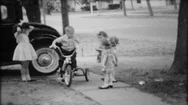 Children Ride Tricycle On Sidewalk In Neighborhood 1950S Vintage Home Movie Stock Footage