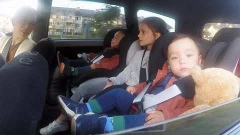Children Riding in Backseat of Car Stock Footage