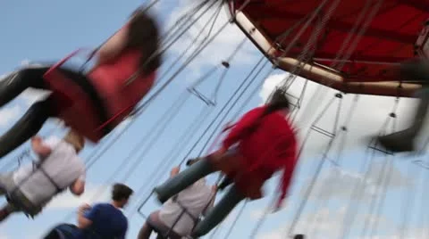 Children riding carousel at the funfair 库存影片 11344190