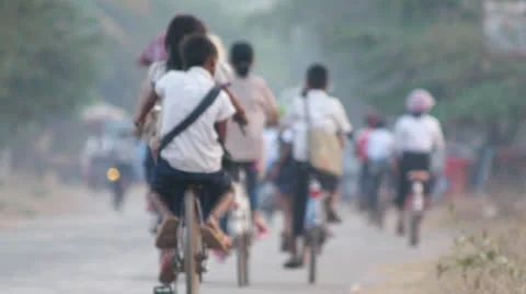 Children riding to school in Cambodia Stock Footage 24928043
