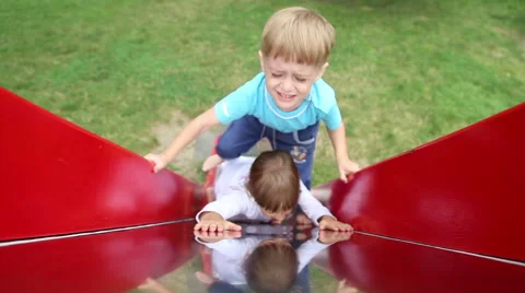 Children riding on a sliding board Stock Footage 52433080
