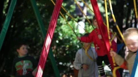 Children riding on a swing. Video stock 12367427