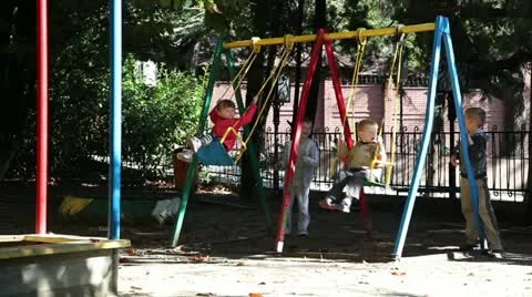Children riding on a swing. Stock-Footage 12367806