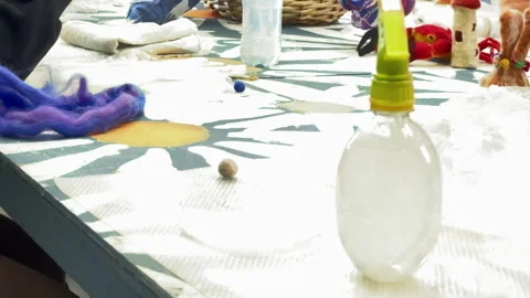 Children roll balls of wool, children's master class on felting wool toys Stock Footage 306569341