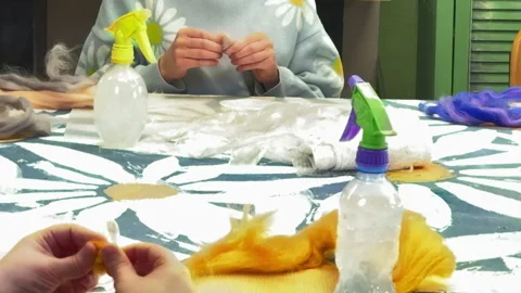 Children roll balls of wool, children's master class on felting wool toys Stock-Footage 306569590