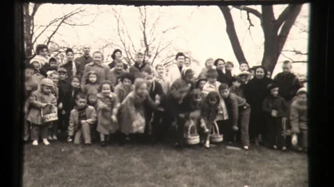 Children Roll Down White House Lawn During Annual Easter Egg Roll Video stock 130701971