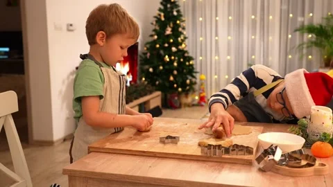 Children rolling out dough with rolling pins Stock Footage 297907331
