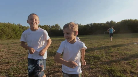 Children run across the field Stock Footage 64887600