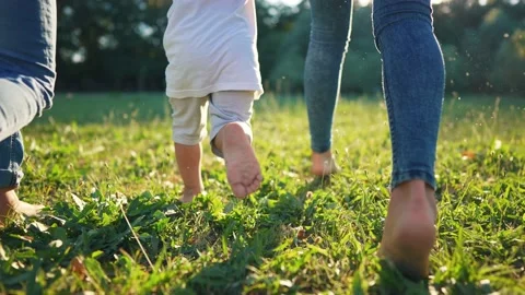 children run in the park. bare feet clos... | Stock Video | Pond5