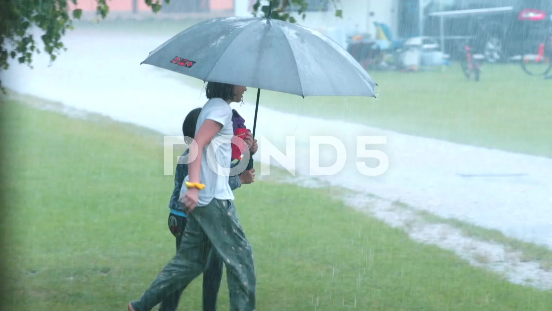 Children Run In The Rain Under An Umbrel Stock Video Pond5