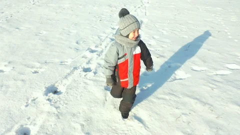 Children run in the snow Stock Footage 120288519