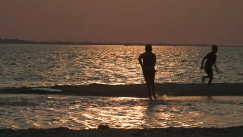Children run in surf Stock Footage 158498449
