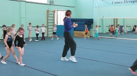 Children running back on acrobatic lessons Stock Footage 39980605