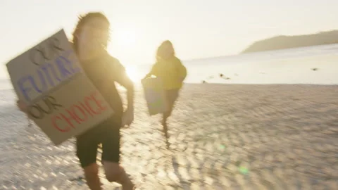 Children running to the camera, on the seaside, at sunset light with the posters Stock Footage 191446938
