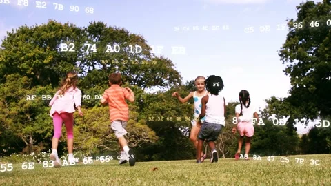Children running downhill playing chase, chasing ball while white codes overlay Stock Footage 333936628