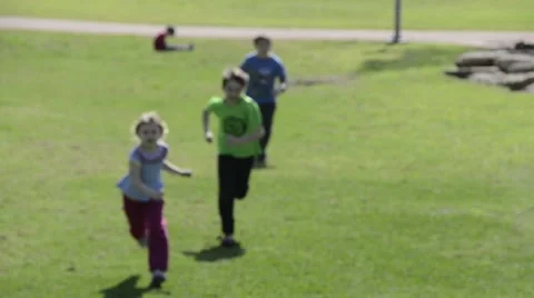 Children running on the grass Stock Footage 47599625