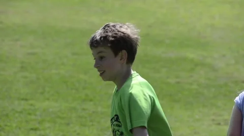 Children running on the grass Stock Footage 47599834