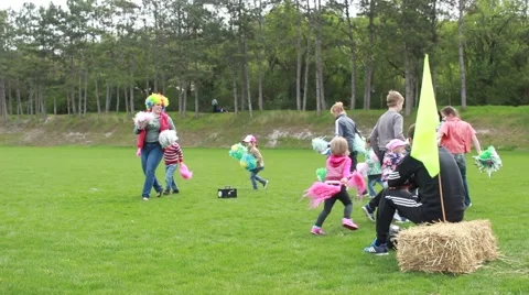 Children running on a lawn Stock Footage 62710485