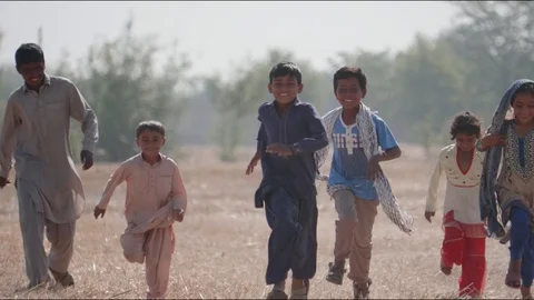 Children running towards the camera. Video stock 90679984