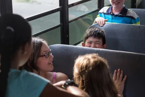 Children on the School Bus Stock Photos