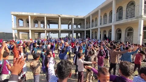 Children in a school destroyed by war Vídeo Stock 160576893